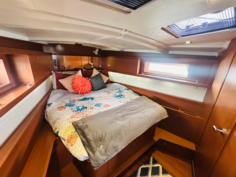 Slide: The Image of Luxurious cabin interior of 2015 Beneteau Oceanis 45 sailboat with cozy bedding. - 48