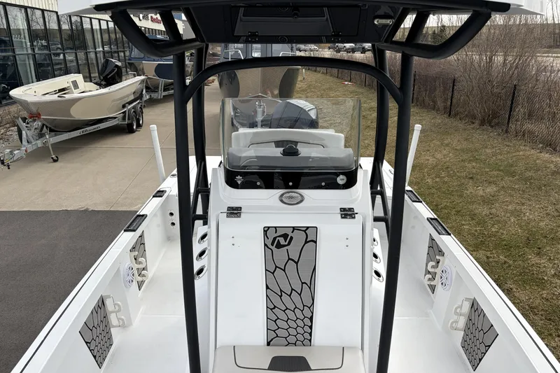 Slide: The Image of 2019 Wellcraft 221 Bay boat interior with modern console and seating. - 16