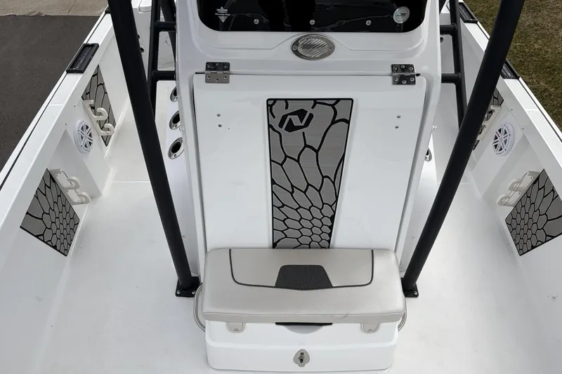 Slide: The Image of 2019 Wellcraft 221 Bay boat interior with seating and storage compartments. - 17