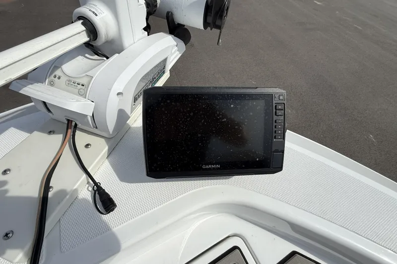 Slide: The Image of Garmin device on 2019 Wellcraft 221 Bay boat dashboard, near trolling motor. - 18
