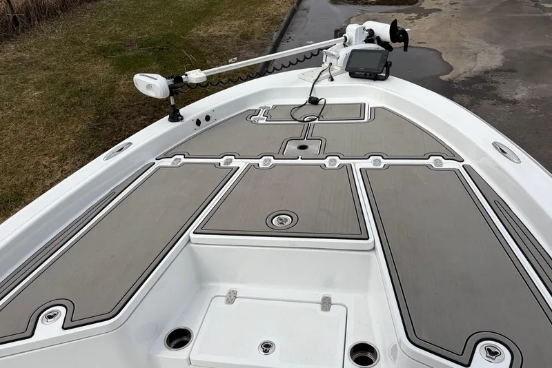 Slide: The Image of 2019 Wellcraft 221 Bay boat deck with fishing equipment and navigation system. - 19