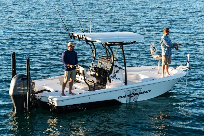 Slide: The Image of Manufacturer Provided Image: 2019 Wellcraft 221 Bay boat with two people fishing on calm water. - 27