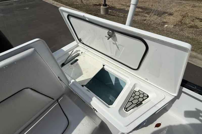Slide: The Image of Open storage compartment on a 2019 Wellcraft 221 Bay boat, showcasing interior space. - 8
