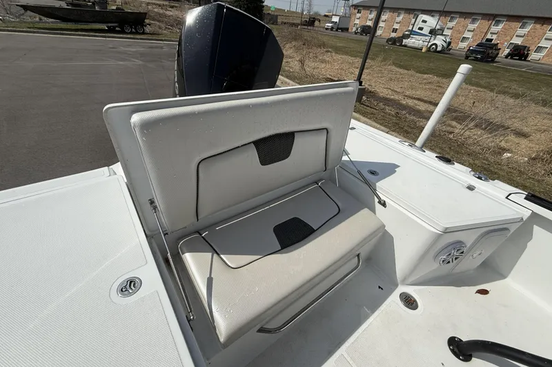 Slide: The Image of 2019 Wellcraft 221 Bay boat with open storage compartment on deck. - 9