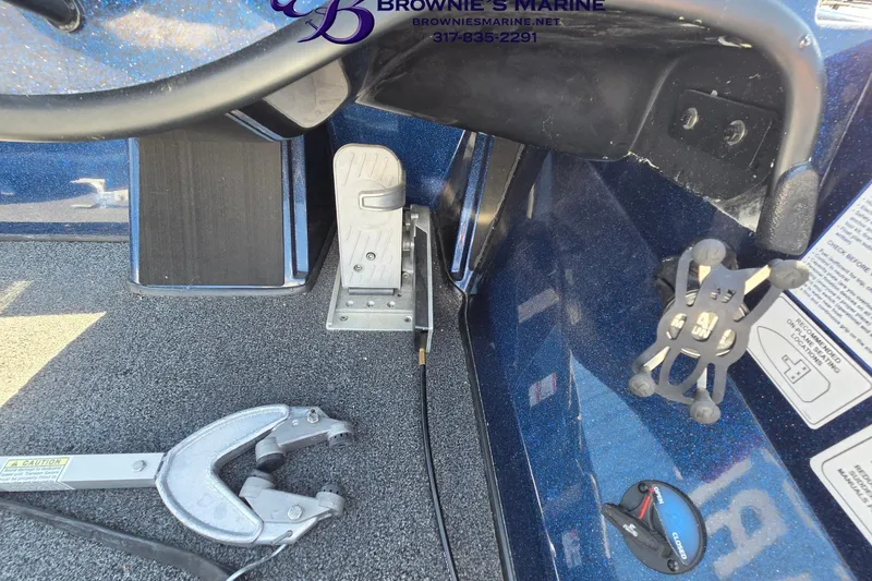 Slide: The Image of 2024 Nitro Z18 boat interior with steering wheel, pedal, and equipment holder. - 10