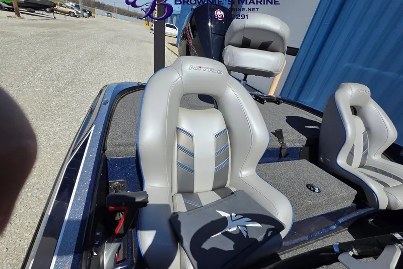 Slide: The Image of 2024 Nitro Z18 boat interior with gray seats and steering wheel detail. - 12
