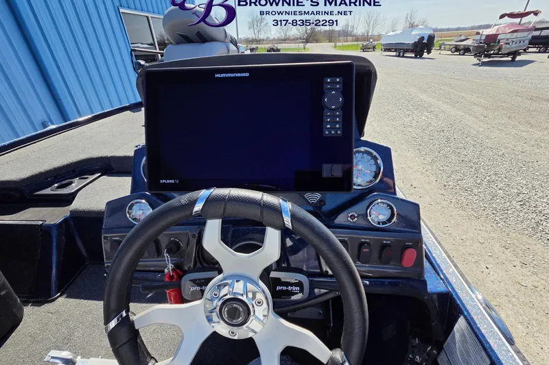 Slide: The Image of 2024 Nitro Z18 boat dashboard with steering wheel and electronic display at Brownie's Marine. - 13
