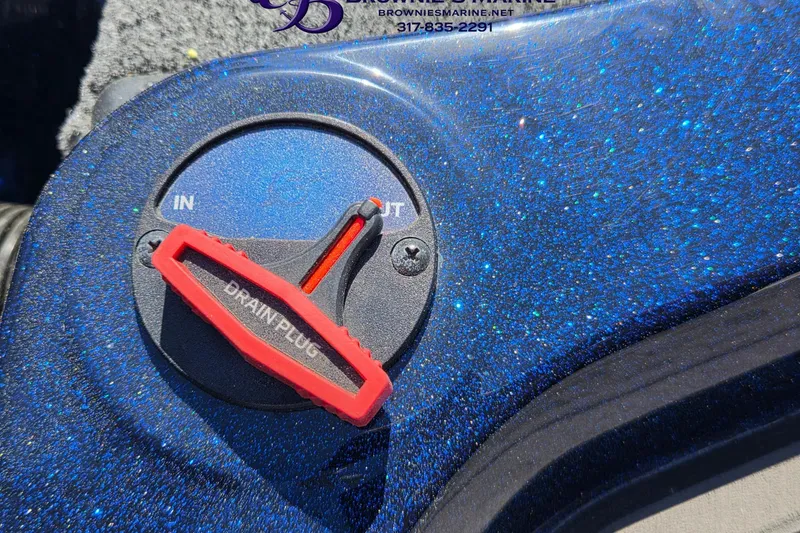 Slide: The Image of 2024 Nitro Z18 drain plug with red handle on sparkly blue surface. - 15