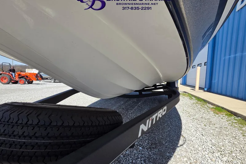 Slide: The Image of 2024 Nitro Z18 boat on trailer at Brownie's Marine dealership. - 16