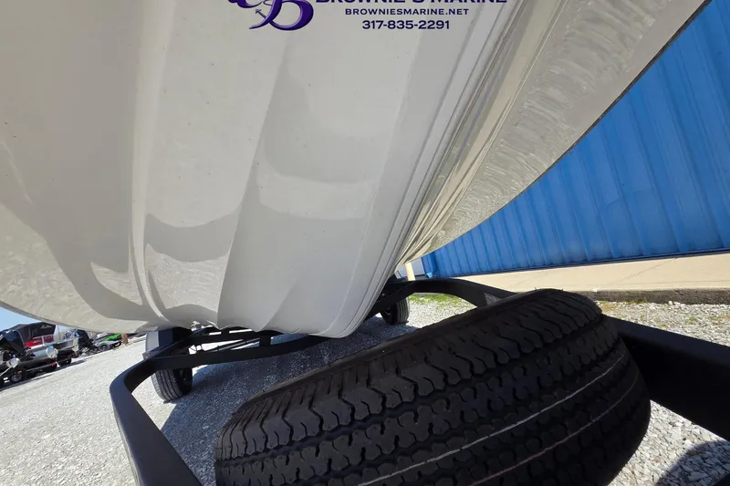 Slide: The Image of 2024 Nitro Z18 boat on trailer, showcasing hull and tire details. - 17