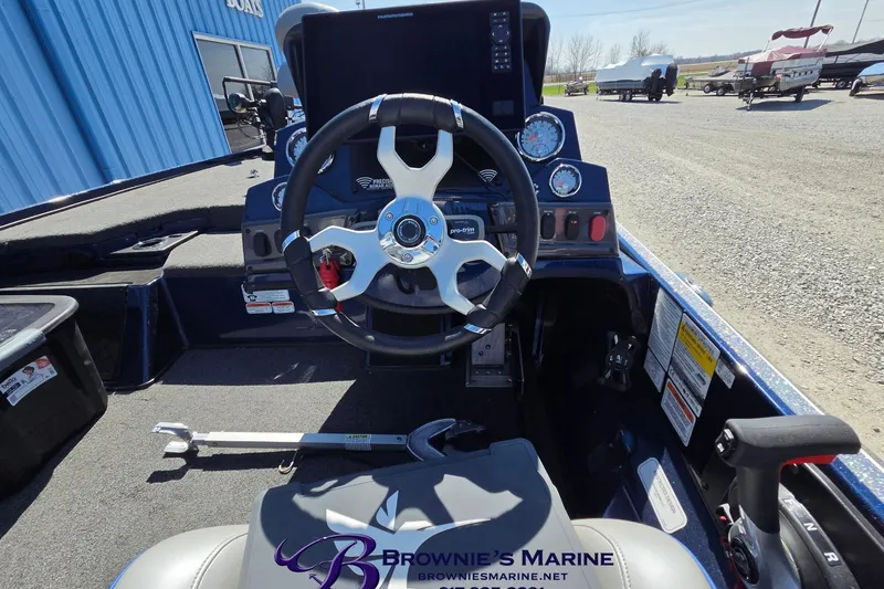 Slide: The Image of 2024 Nitro Z18 boat cockpit with steering wheel and control panel at Brownie's Marine. - 9