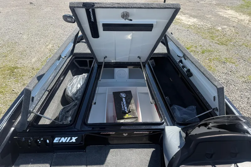 Slide: The Image of Open storage compartments of a 2026 Phoenix 721 ZXL boat, showcasing interior space. - 10