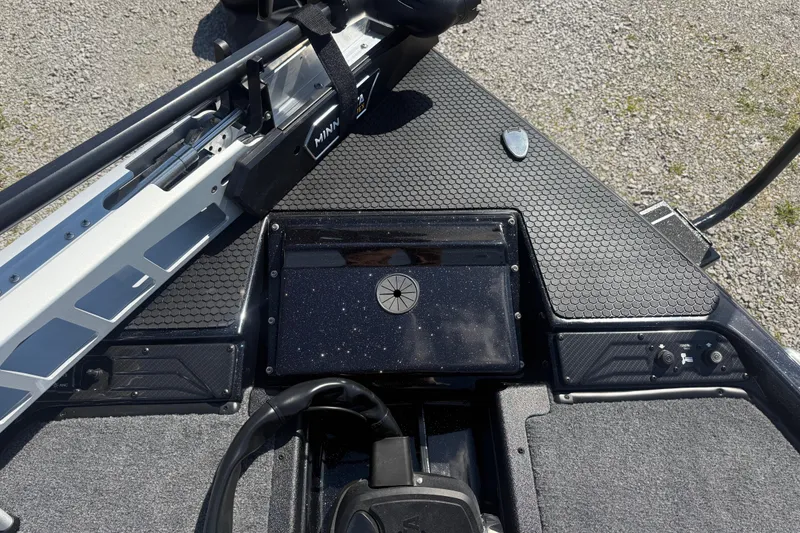 Slide: The Image of 2026 Phoenix 721 ZXL boat deck with Minn Kota trolling motor and control panel. - 12