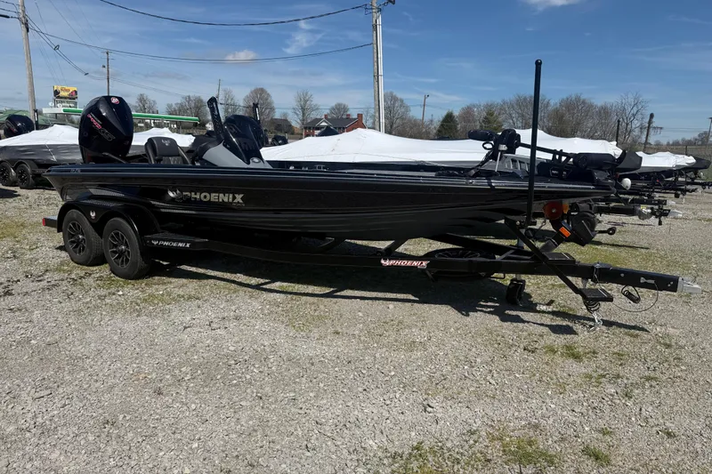 Slide: The Image of 2026 Phoenix 721 ZXL boat on trailer, parked outdoors under clear sky. - 3