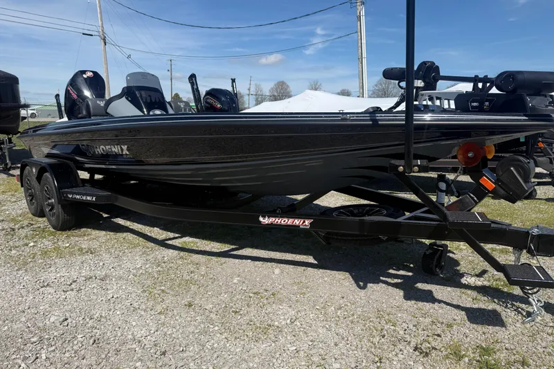 Slide: The Image of 2026 Phoenix 721 ZXL boat on trailer, parked outdoors under clear sky. - 4
