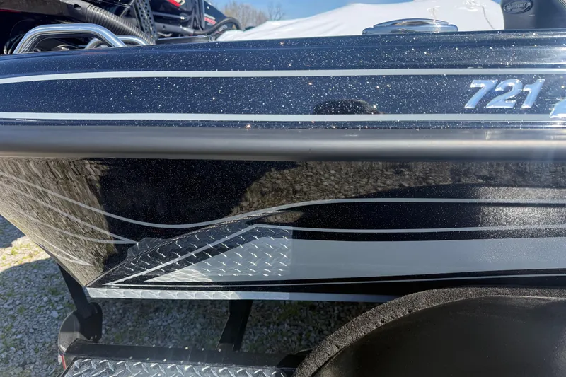 Slide: The Image of 2026 Phoenix 721 ZXL boat with sleek black and silver detailing. - 9