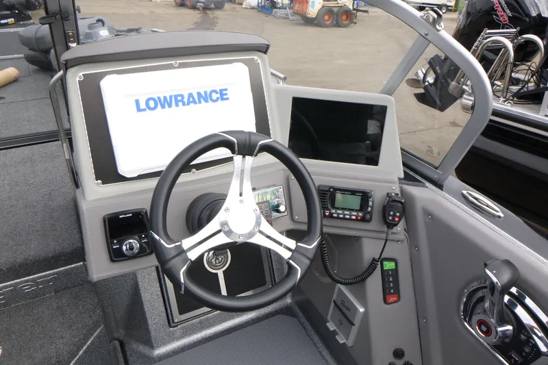 Slide: The Image of 2023 Ranger 622FS Pro boat dashboard with Lowrance display and steering wheel. - 8