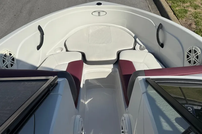 Slide: The Image of Interior view of a 2016 Tahoe 400 TS boat with white and maroon seating. - 10
