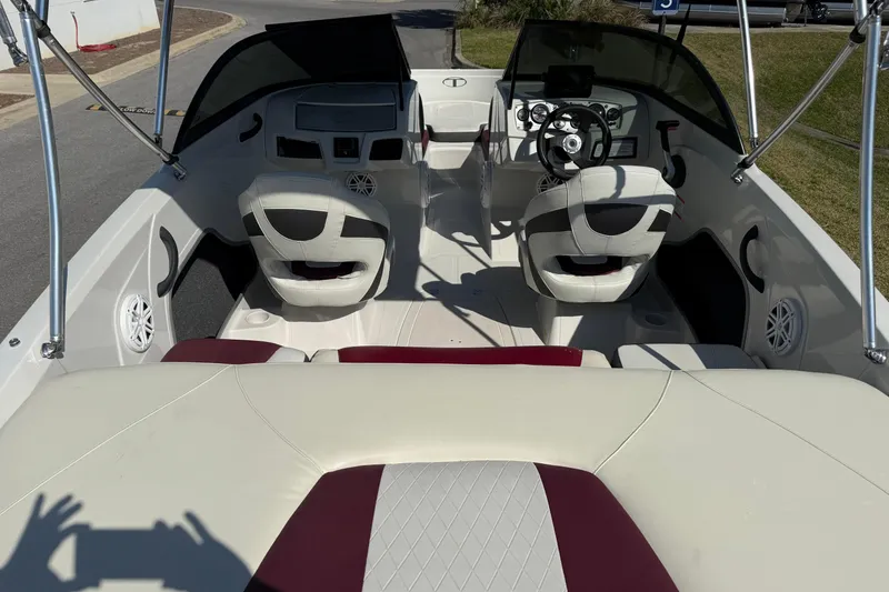 Slide: The Image of 2016 Tahoe 400 TS boat interior with dual seats and steering wheel. - 6