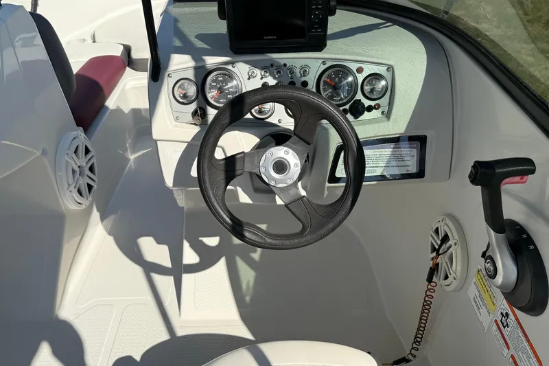 Slide: The Image of Steering console of a 2016 Tahoe 400 TS boat with gauges and controls. - 7