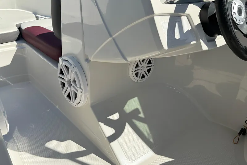 Slide: The Image of Interior of a 2016 Tahoe 400 TS boat showing speakers and steering wheel. - 9