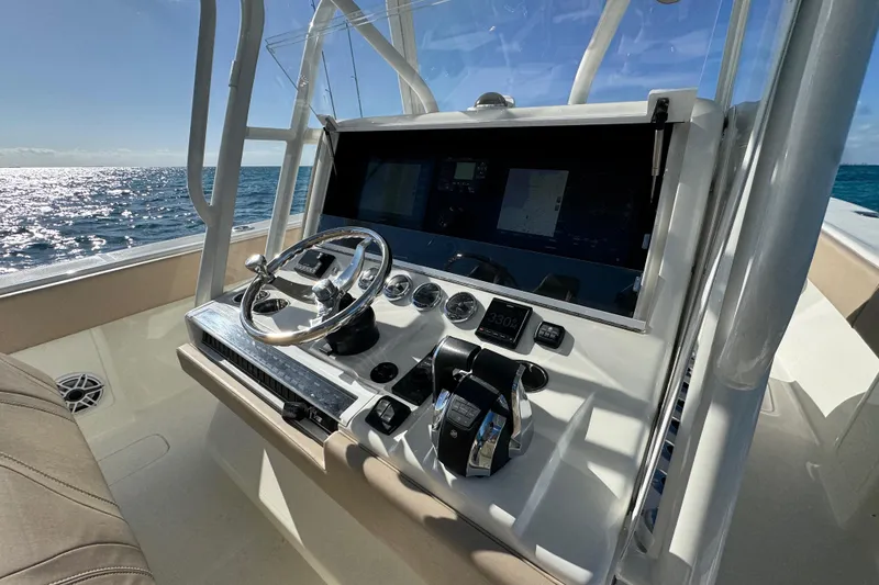 Slide: The Image of 2021 SeaVee Boats 370Z helm with modern controls and ocean view. - 10