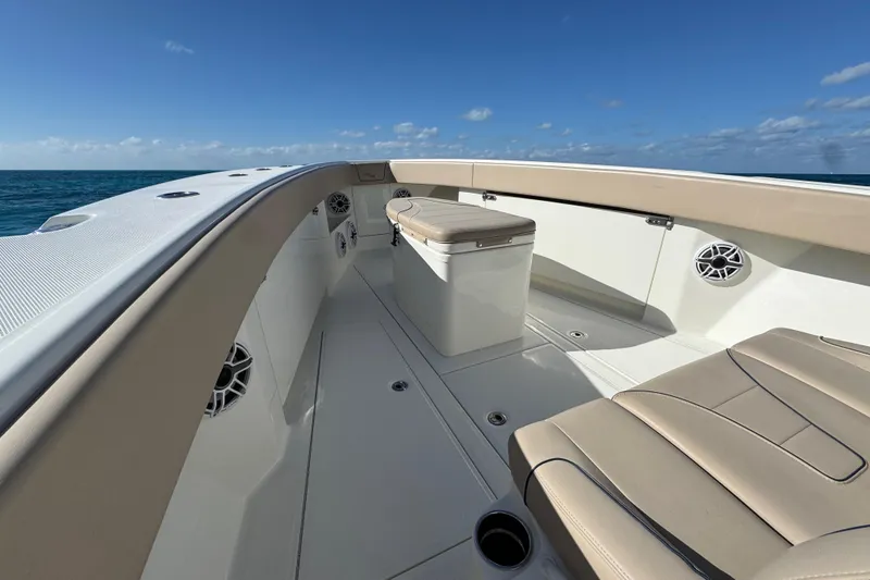 Slide: The Image of 2021 SeaVee Boats 370Z deck view with seating and ocean backdrop. - 12