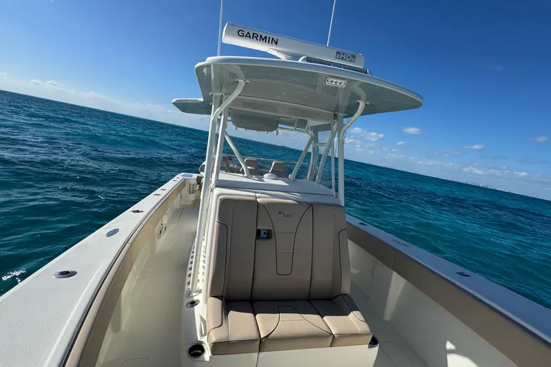 Slide: The Image of 2021 SeaVee Boats 370Z on open ocean, featuring Garmin equipment under clear blue skies. - 14