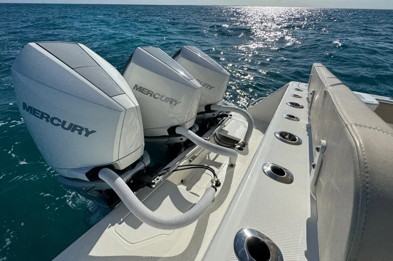 Slide: The Image of 2021 SeaVee Boats 370Z with triple Mercury outboard engines on open ocean. - 21