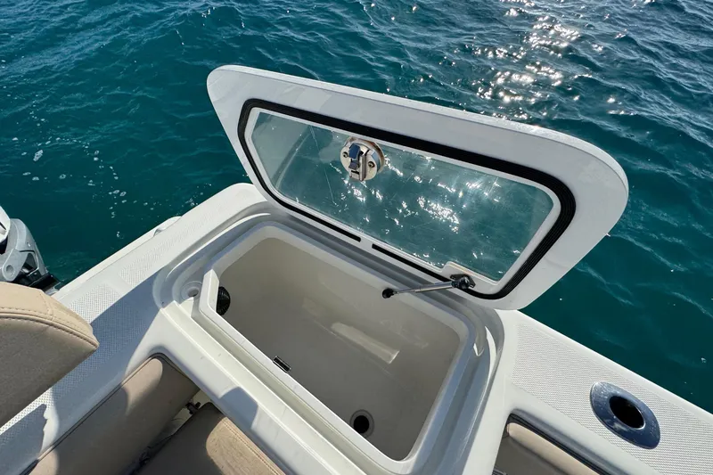 Slide: The Image of SeaVee 370Z 2021 with open storage compartment on the water. - 22