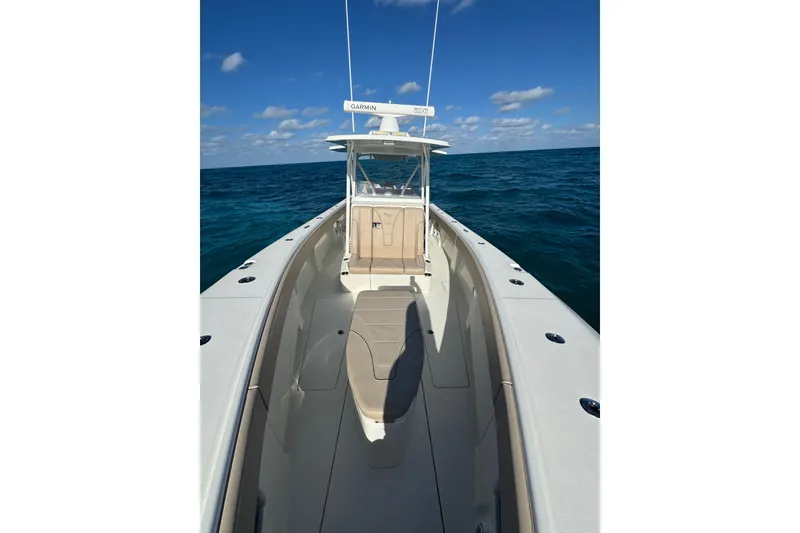 Slide: The Image of 2021 SeaVee Boats 370Z on open ocean under clear blue sky. - 27