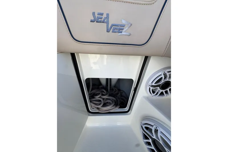 Slide: The Image of 2021 SeaVee Boats 370Z storage compartment with coiled rope and speaker detail. - 29