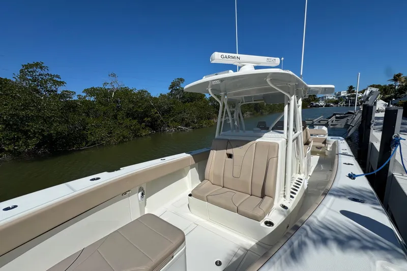 Slide: The Image of 2021 SeaVee Boats 370Z docked, featuring sleek design and comfortable seating. - 9