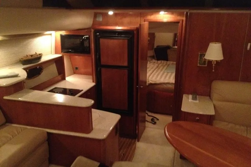 Slide: The Image of Interior of 2004 Meridian 408 Motoryacht with kitchen, seating, and bedroom area. - 5