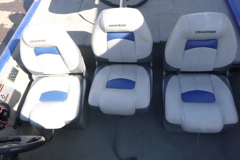 Slide: The Image of 2011 Tracker Pro Team 175 TF boat seats with blue and white upholstery. - 10