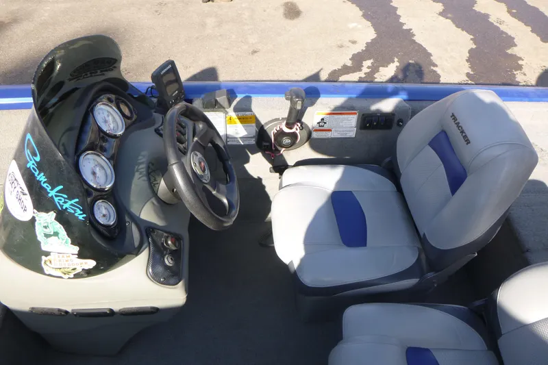 Slide: The Image of 2011 Tracker Pro Team 175 TF boat interior with steering wheel and seats. - 11