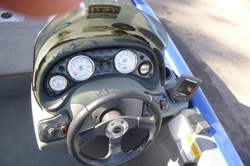 Slide: The Image of 2011 Tracker Pro Team 175 TF boat dashboard with gauges and Lowrance fish finder. - 12