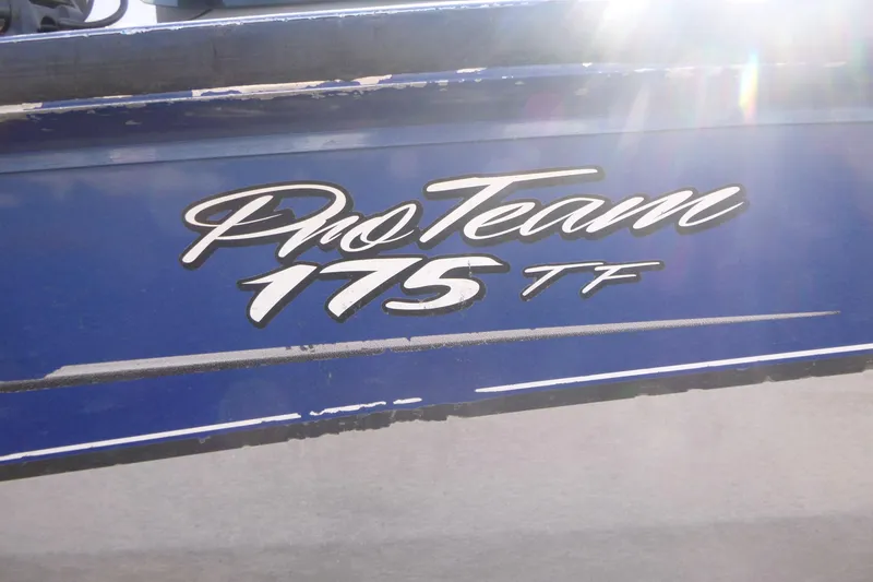 Slide: The Image of 2011 Tracker Pro Team 175 TF boat logo on blue hull. - 16