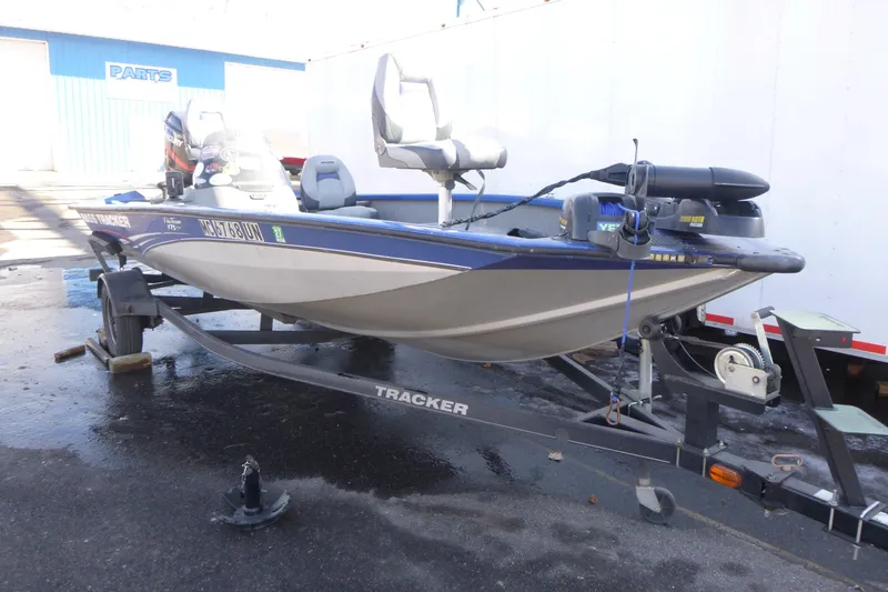 Slide: The Image of 2011 Tracker Pro Team 175 TF fishing boat on trailer, parked outdoors. - 3