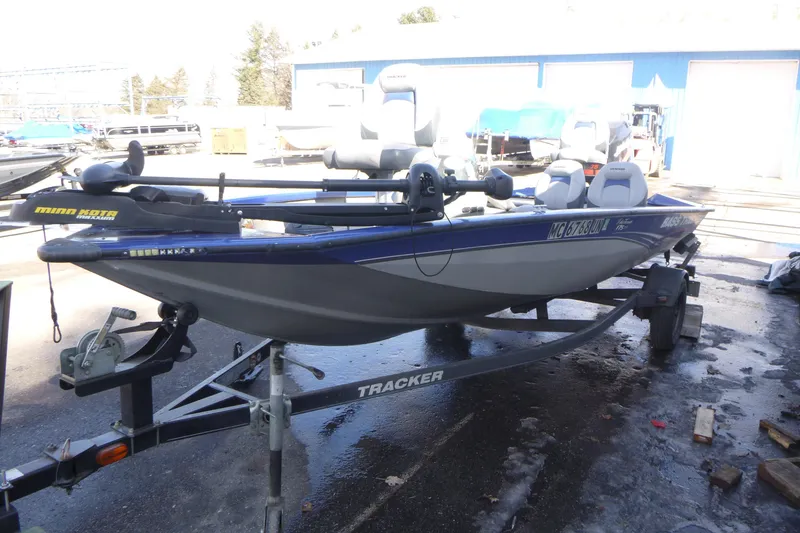 Slide: The Image of 2011 Tracker Pro Team 175 TF fishing boat on trailer, equipped with Minn Kota trolling motor. - 4