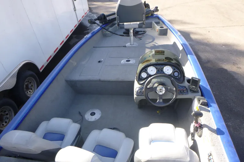 Slide: The Image of 2011 Tracker Pro Team 175 TF boat interior with steering console and seating. - 5