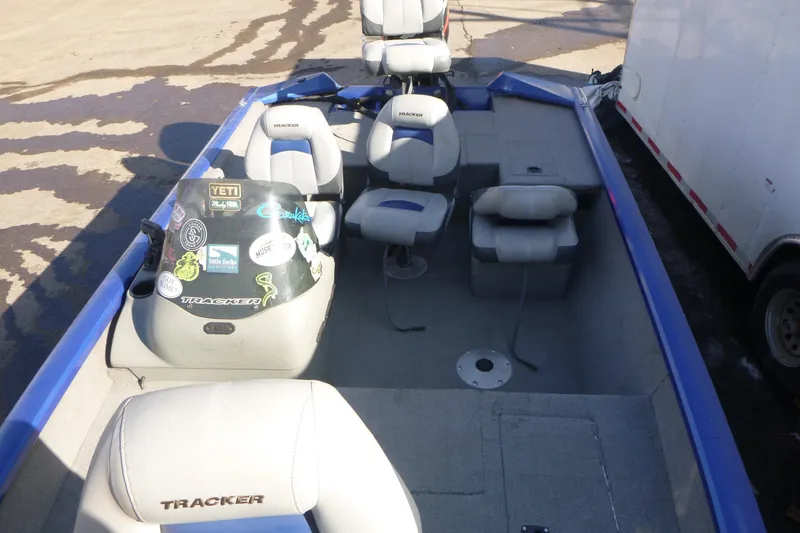 Slide: The Image of 2011 Tracker Pro Team 175 TF boat interior with seating and console stickers. - 6