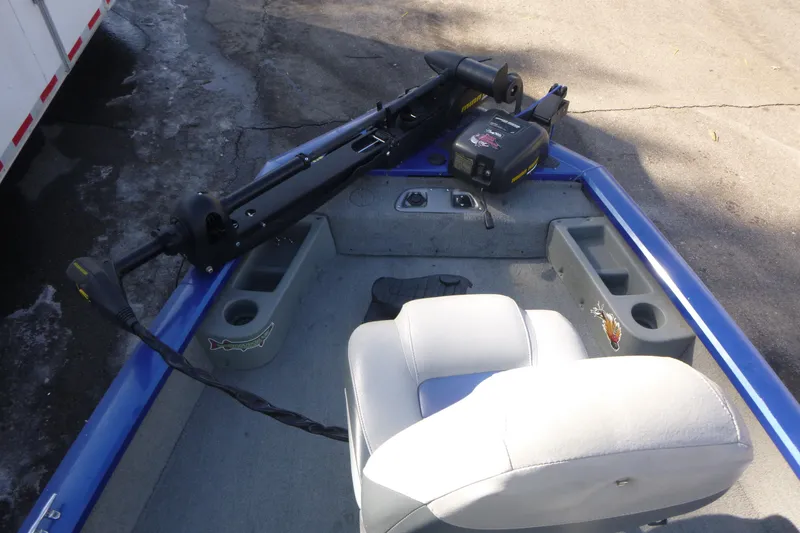 Slide: The Image of 2011 Tracker Pro Team 175 TF boat interior with seating and trolling motor. - 7