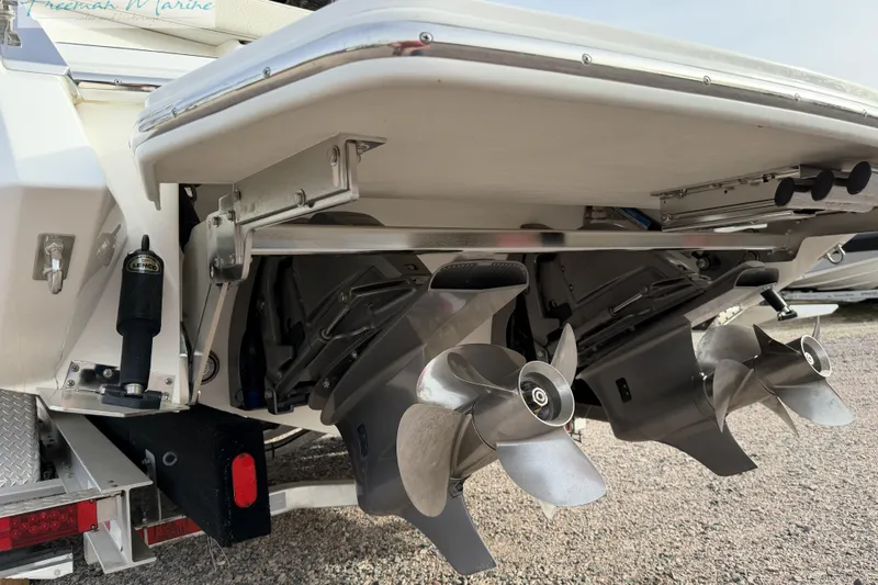Slide: The Image of 2021 Cobalt R30 boat with dual propellers and trim tabs, rear view. - 10