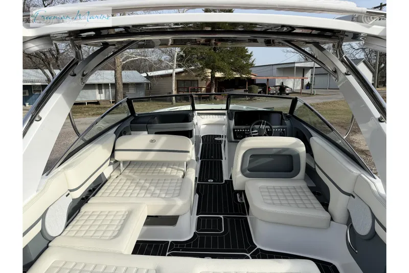 Slide: The Image of 2021 Cobalt R30 boat interior with luxurious seating and modern dashboard design. - 15