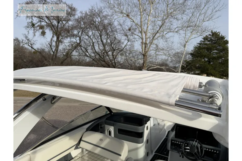 Slide: The Image of 2021 Cobalt R30 boat with white retractable canopy, interior view. - 16