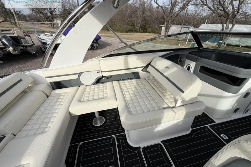 Slide: The Image of 2021 Cobalt R30 boat interior with luxurious white seating and modern design. - 19