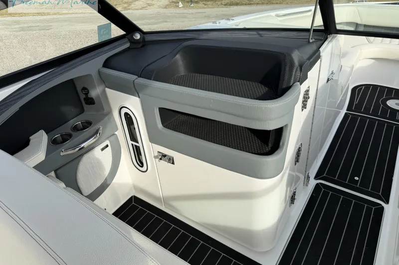 Slide: The Image of 2021 Cobalt R30 boat interior with cup holders and seating area. - 22