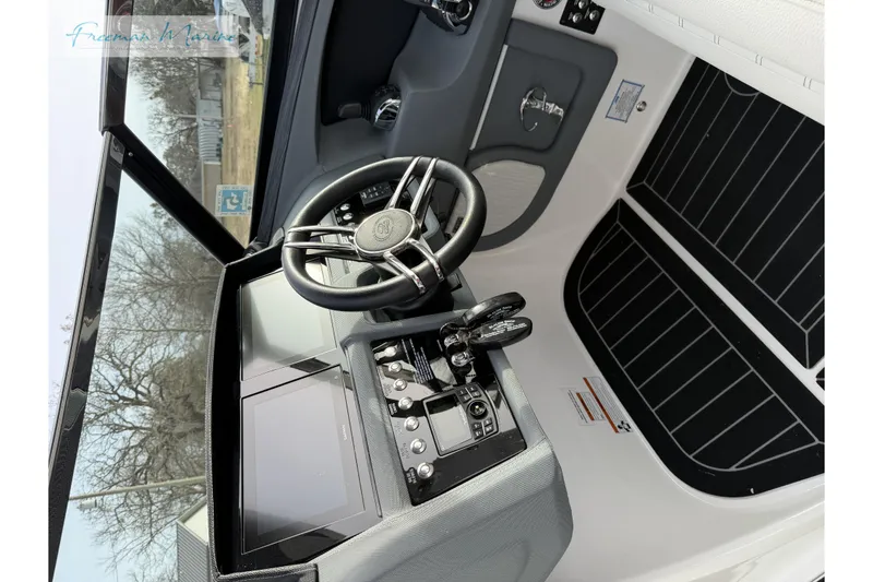 Slide: The Image of 2021 Cobalt R30 boat cockpit with modern steering and control panel. - 26