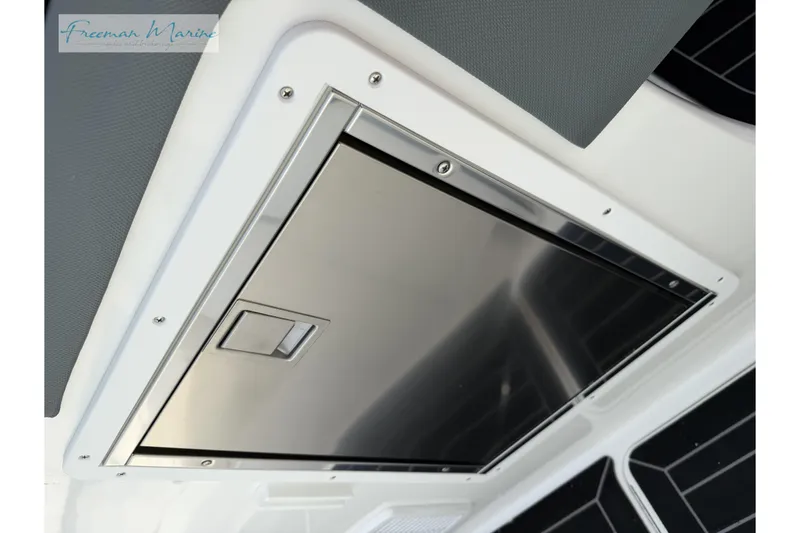 Slide: The Image of Stainless steel hatch on 2021 Cobalt R30 boat, featuring Freeman Marine branding. - 27